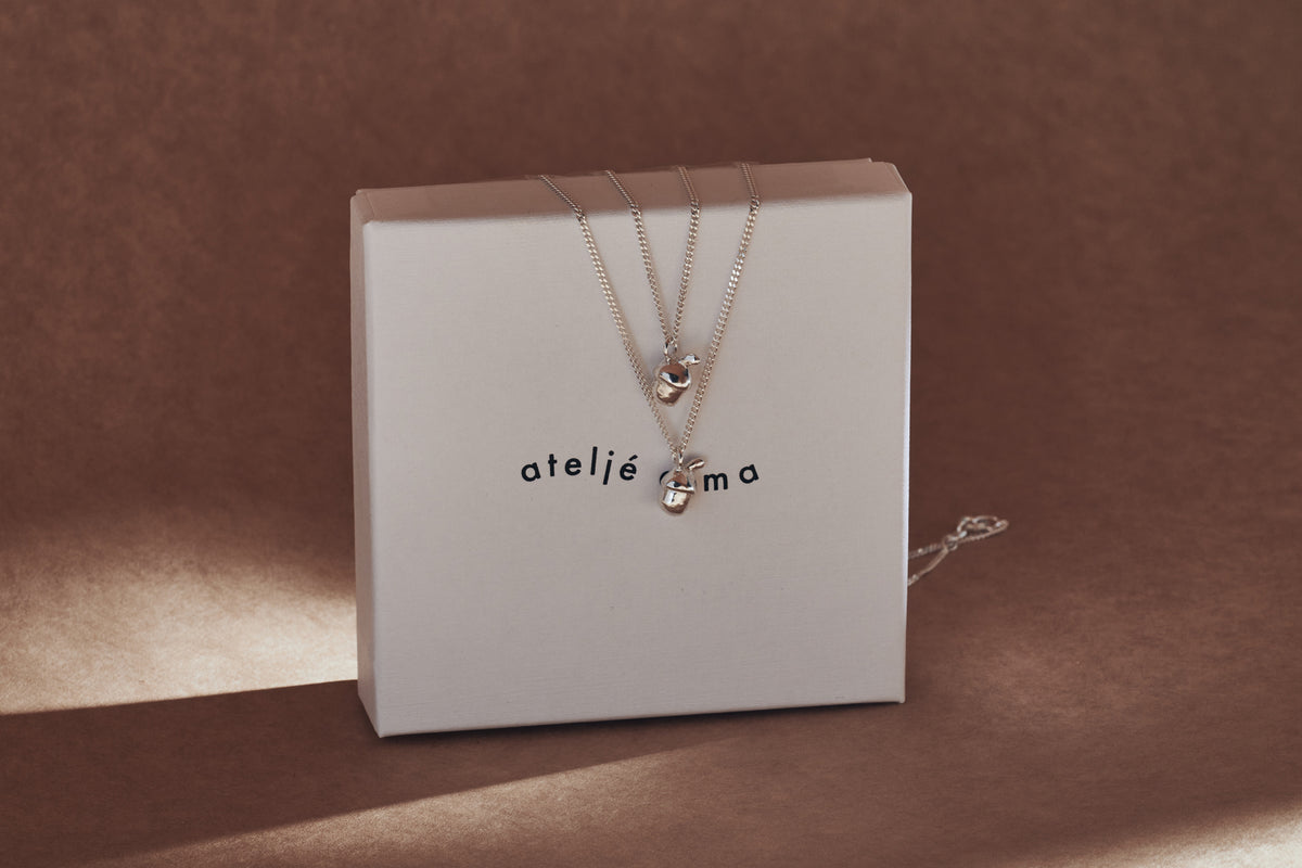 Silver acorn necklaces on Ateljé Alma gift box