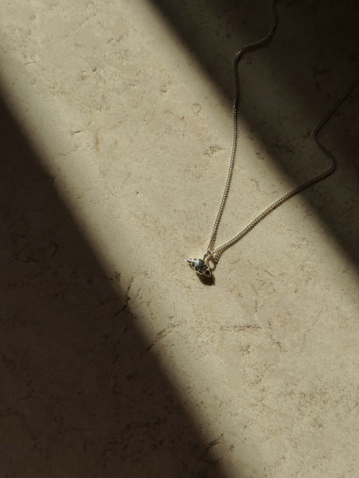 SILVER CROISSANT NECKLACE